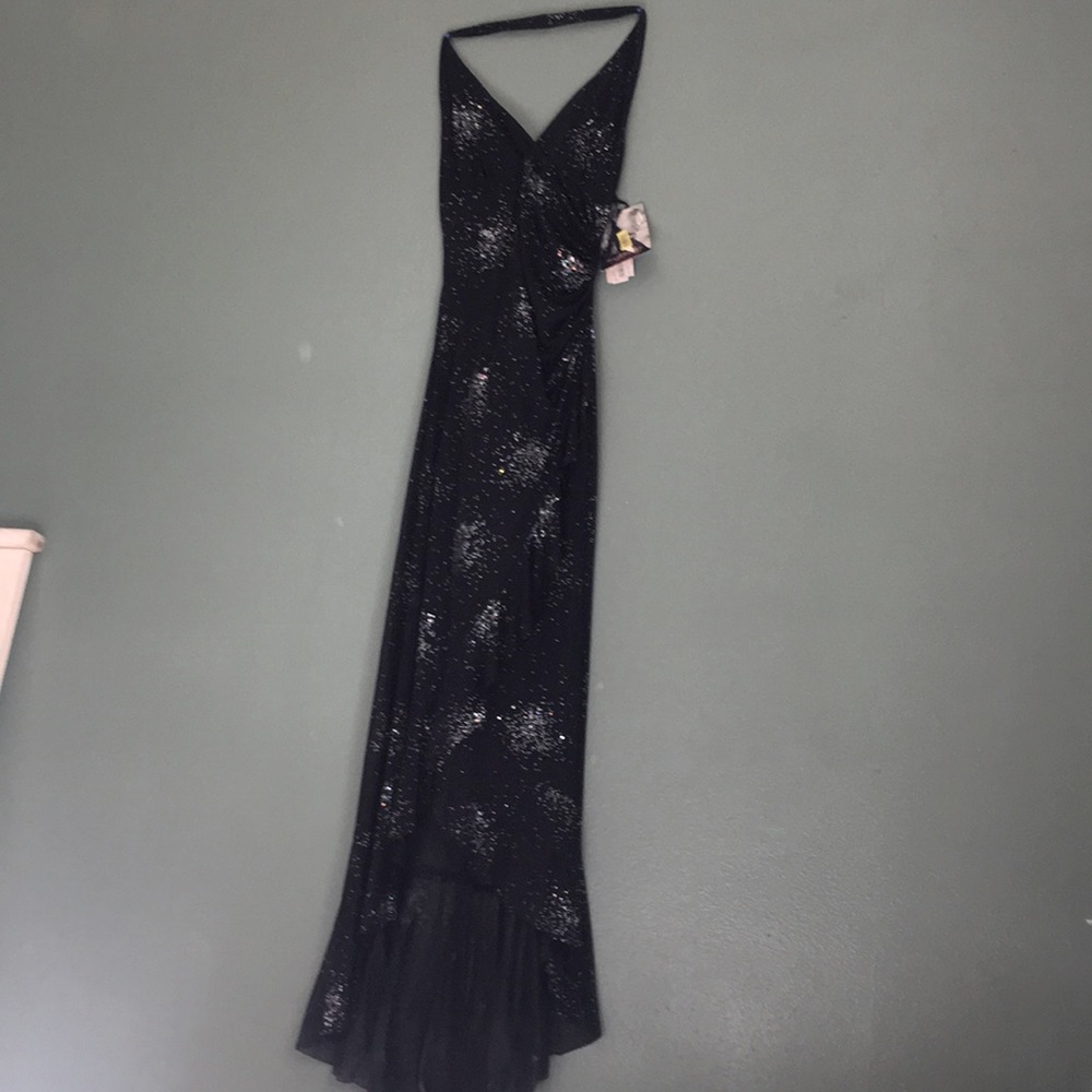 Black dress mermaid style with glitter backless and hangs on neck